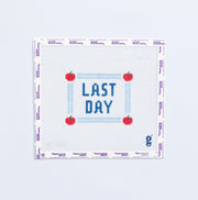 Needlepoint pattern with 'Last Day' text and red apples on a white background