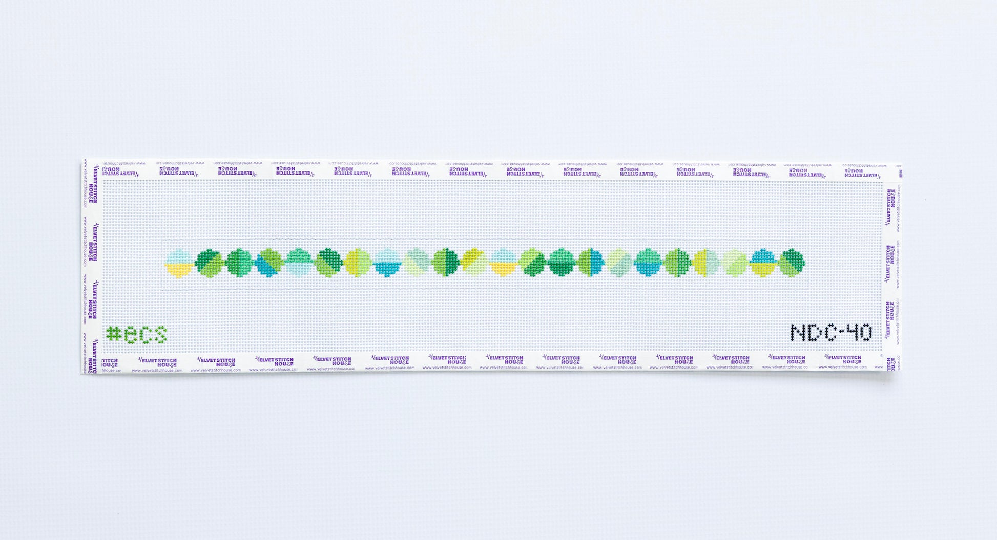 Needlepoint dog collar pattern with green and blue geometric circle pattern