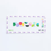 Needlepoint pattern with colorful geometric circles on a white background