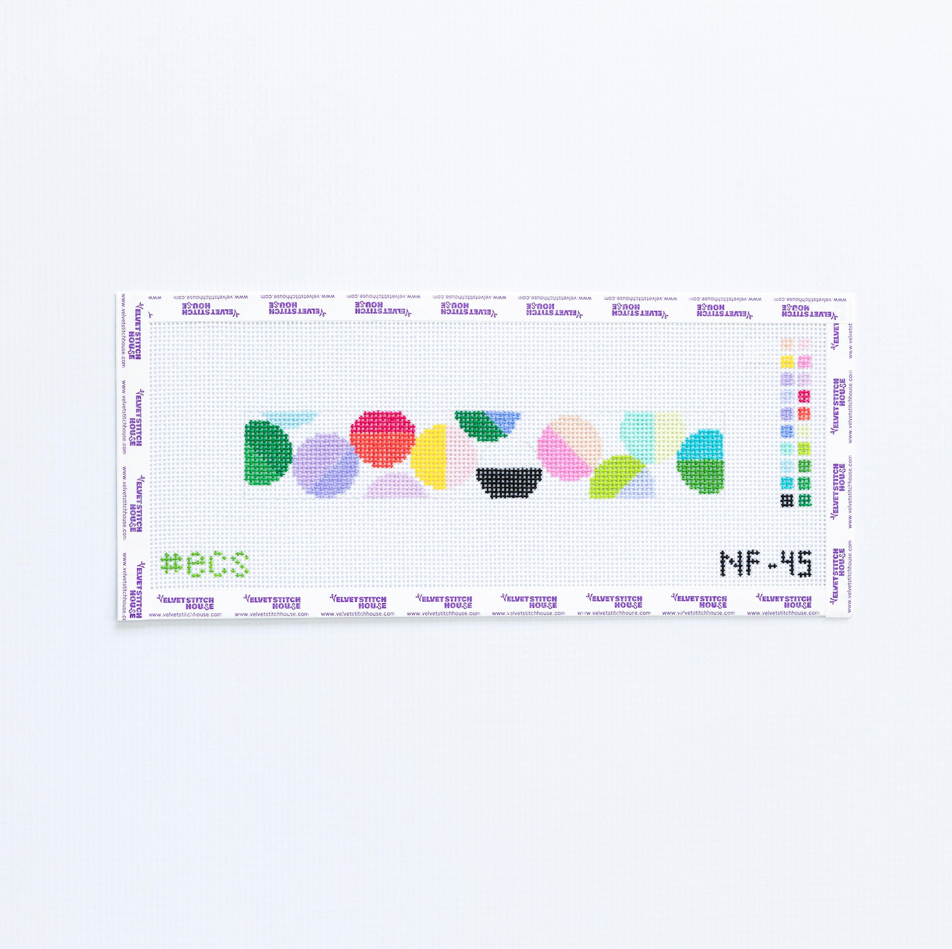 Needlepoint pattern with colorful geometric circles on a white background