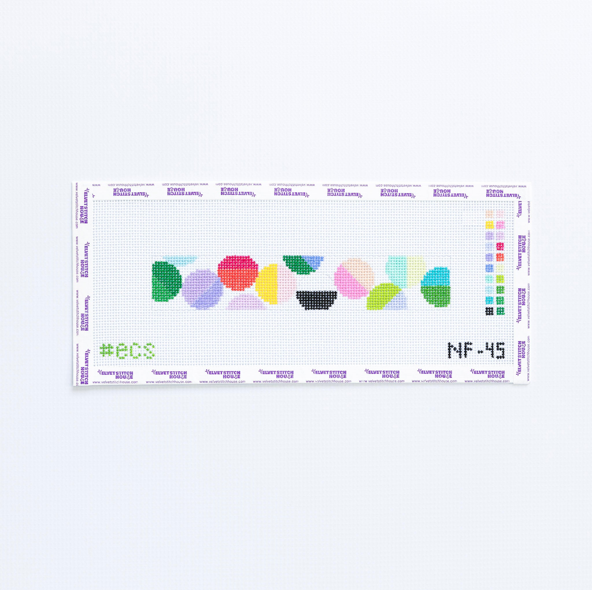 Needlepoint pattern with colorful geometric circles on a white background