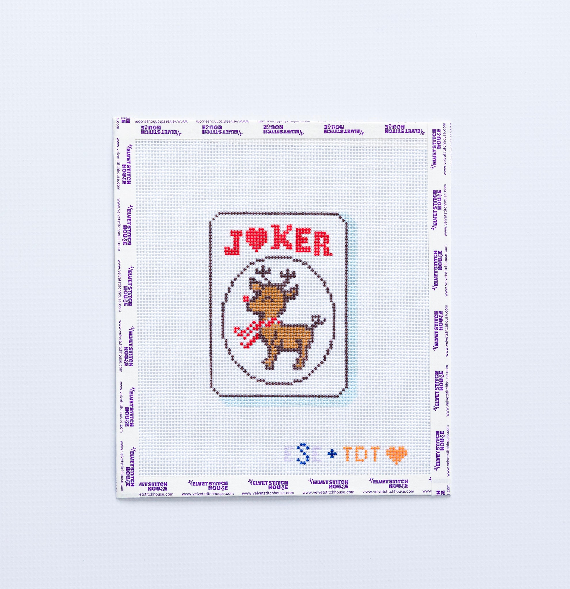 Needlpoint design of a reindeer on a JOKER mahjong tile on a white background