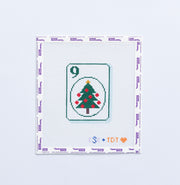 Needlepoint pattern of a green christmas tree on a number 9 Mahjong tile on a white background