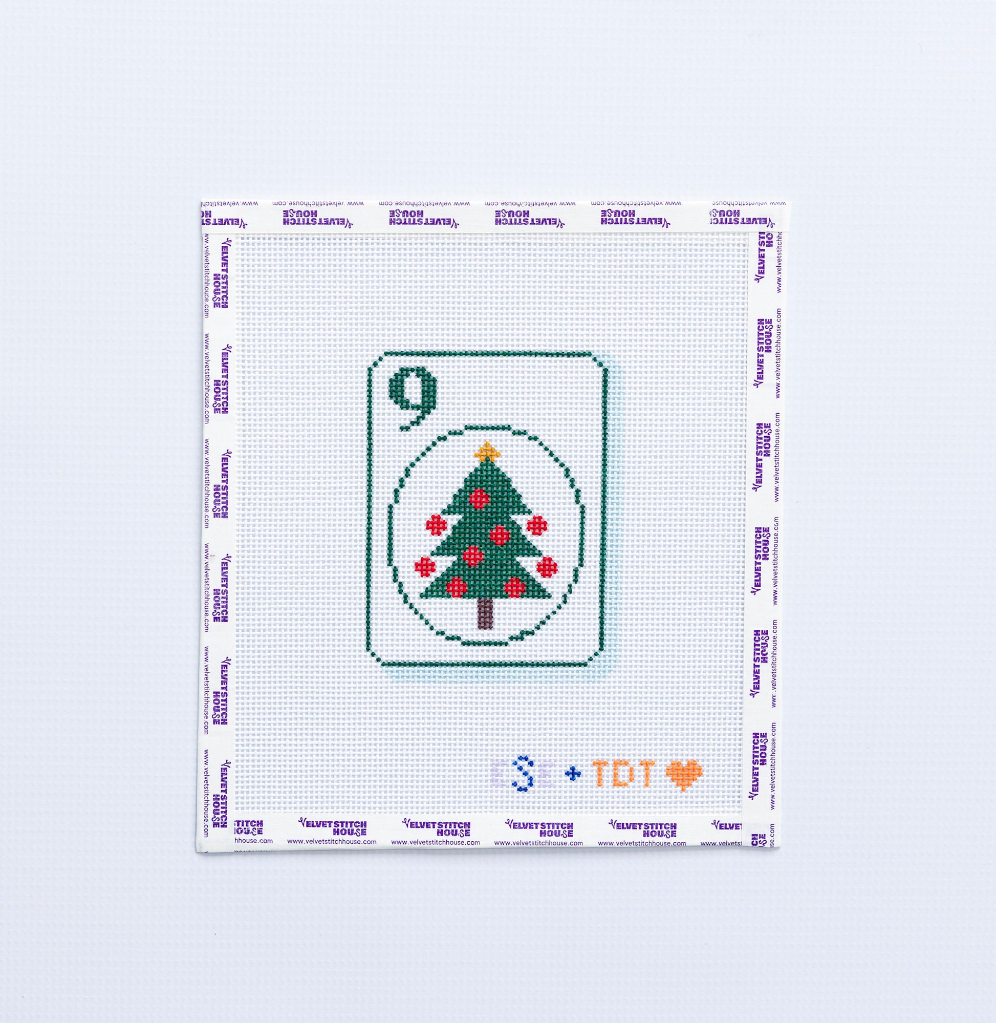 Needlepoint pattern of a green christmas tree on a number 9 Mahjong tile on a white background