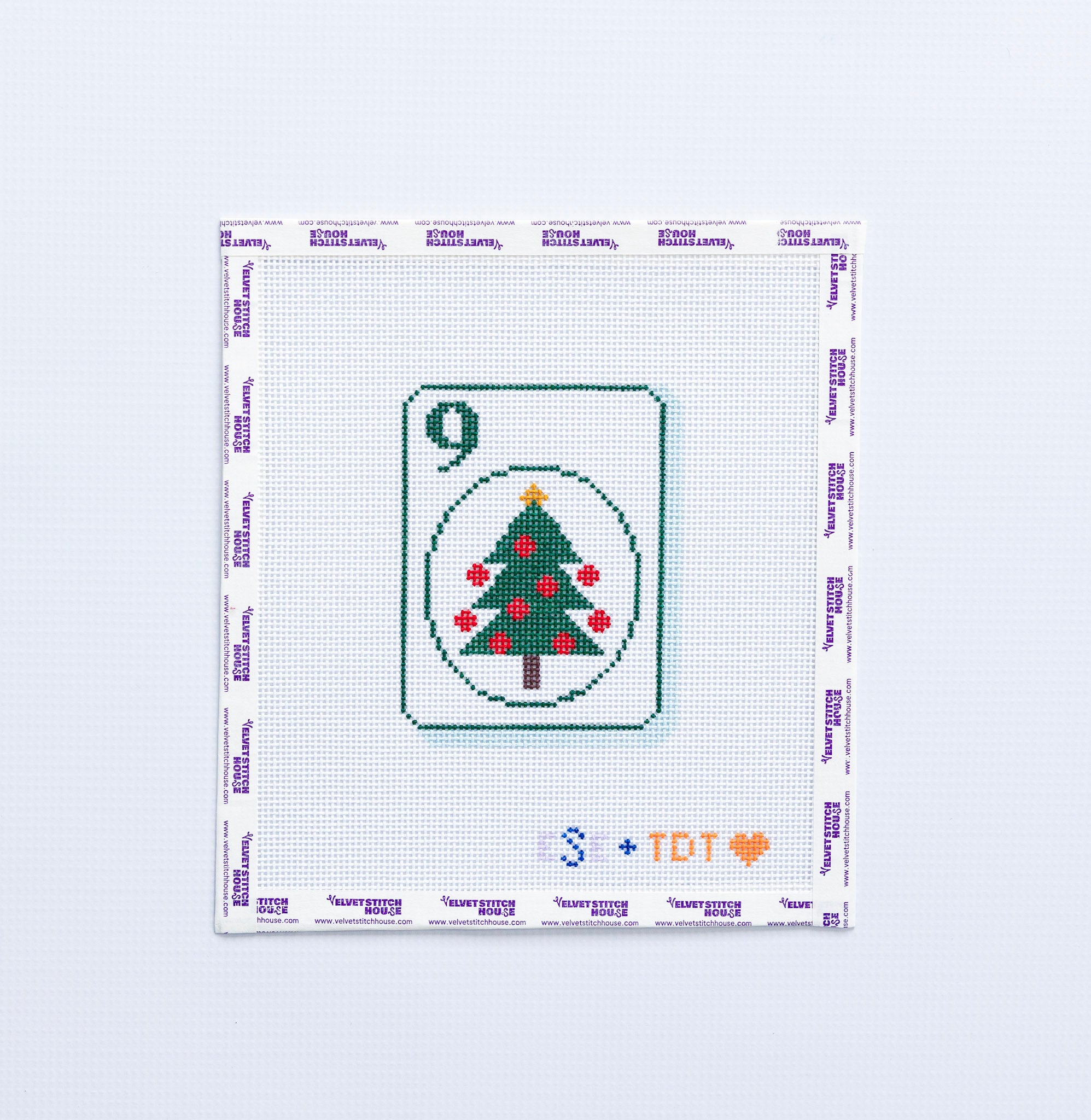 Needlepoint pattern of a green christmas tree on a number 9 Mahjong tile on a white background