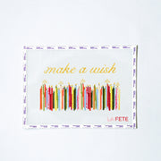 Decorative needlepoint design with colorful candles and 'make a wish' text on a white background