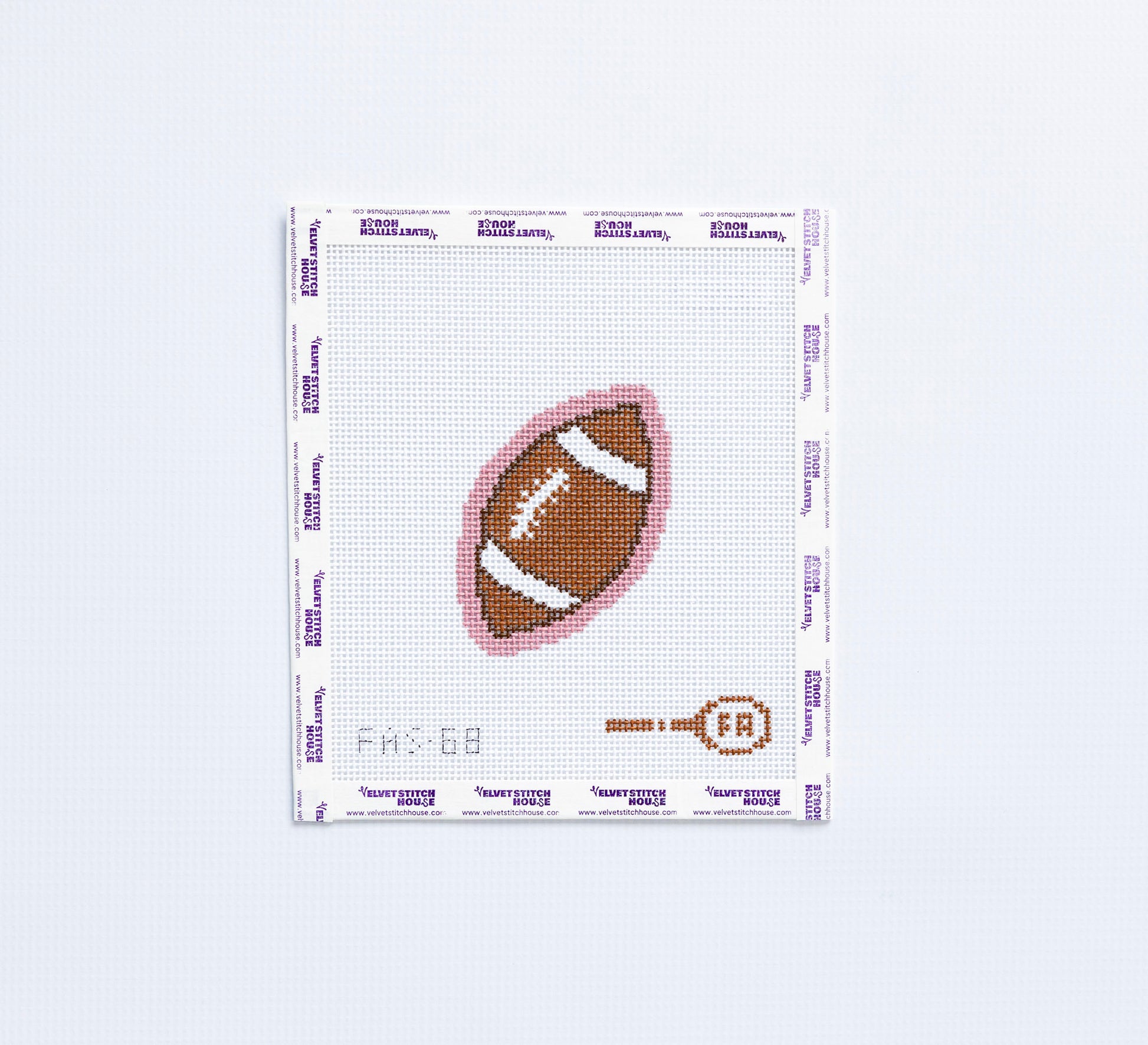 Needlepoint pattern of a football on fabric with a light pink border