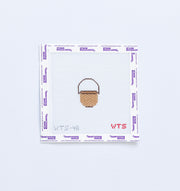 Mini needlepoint pattern with a basket design on a white background