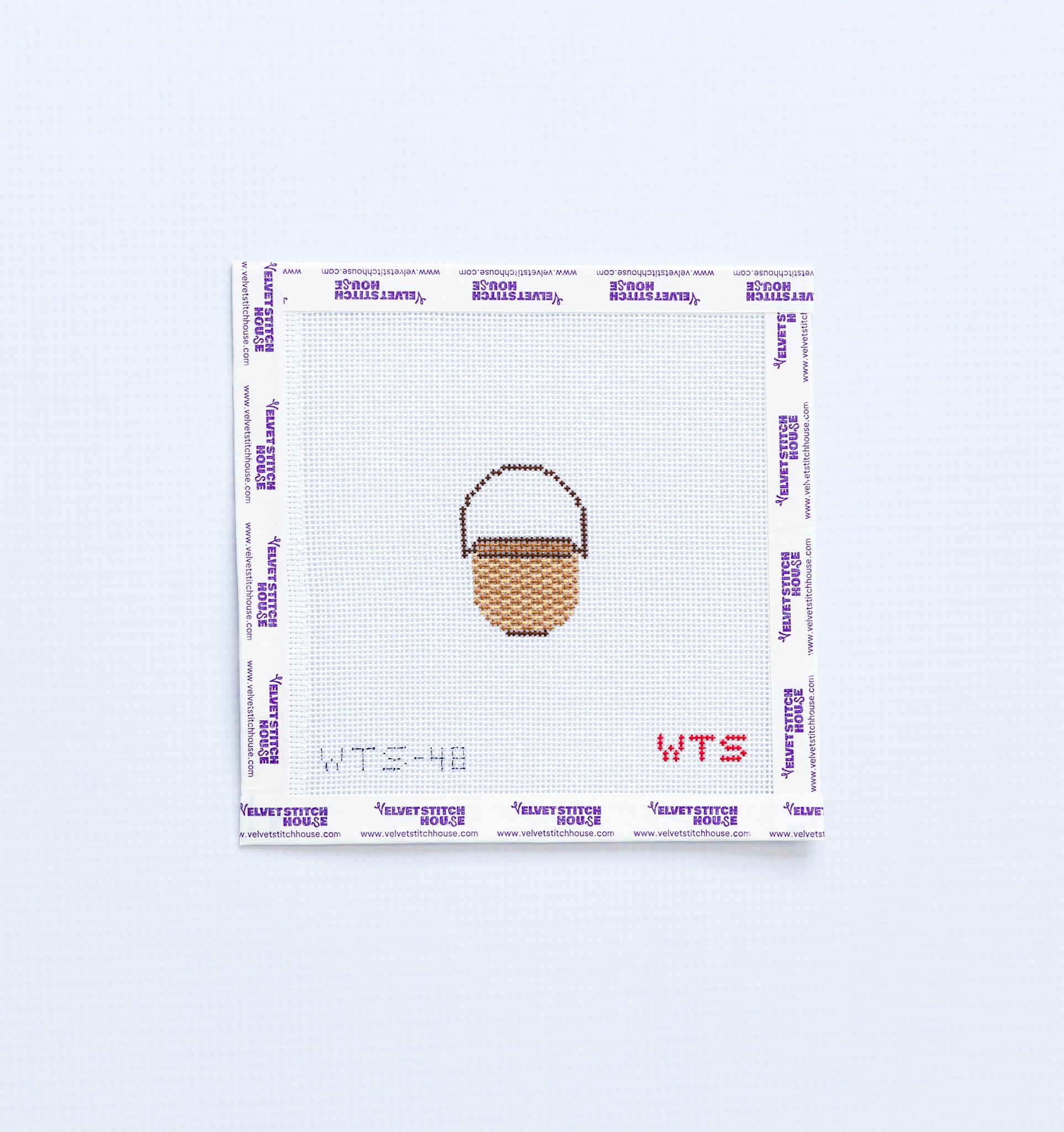 Mini needlepoint pattern with a basket design on a white background