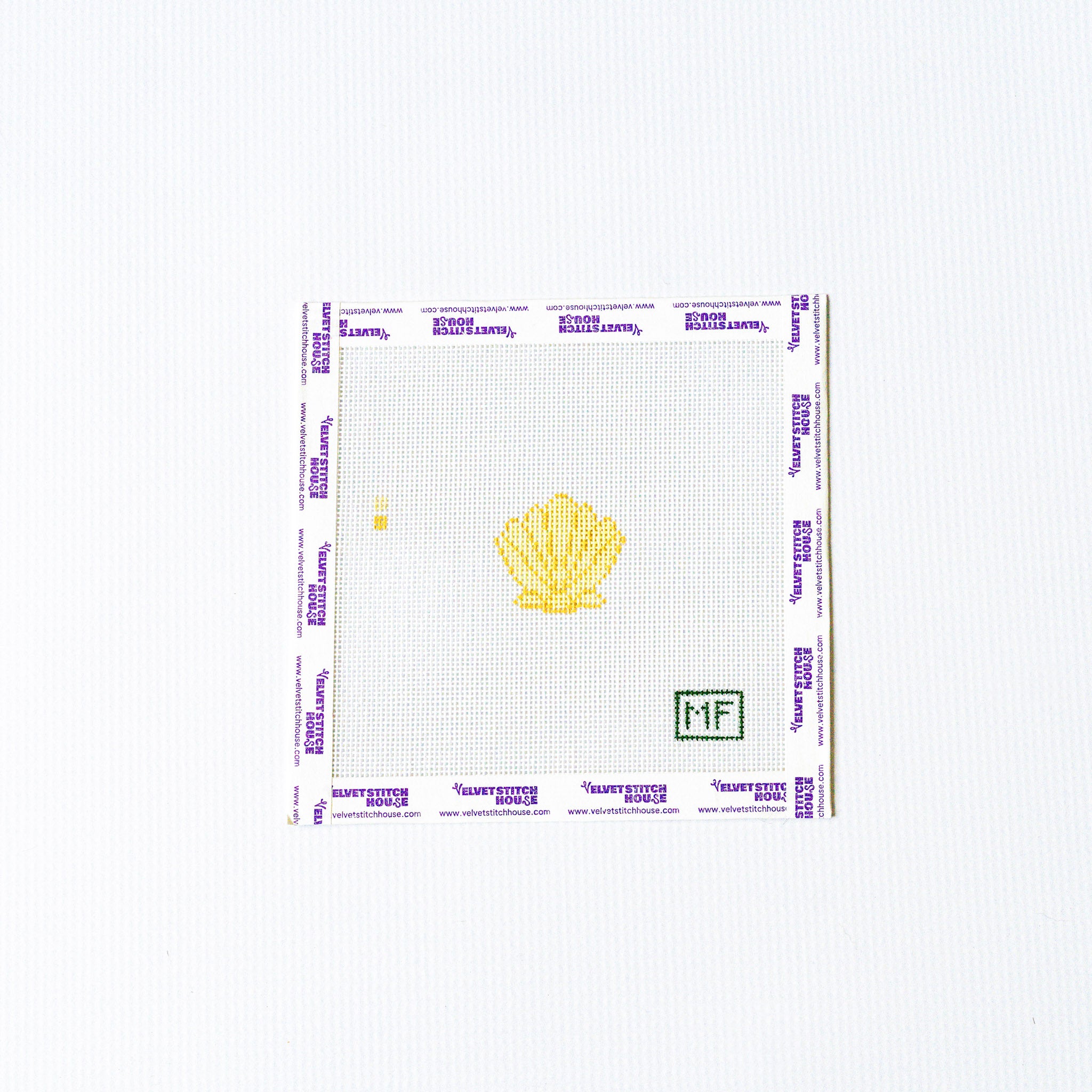 Needlepoint design of a yellow shell with a grid pattern on a white background
