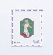 Needlepoint esign of a duck wearing a hat and striped shirt on a green background.