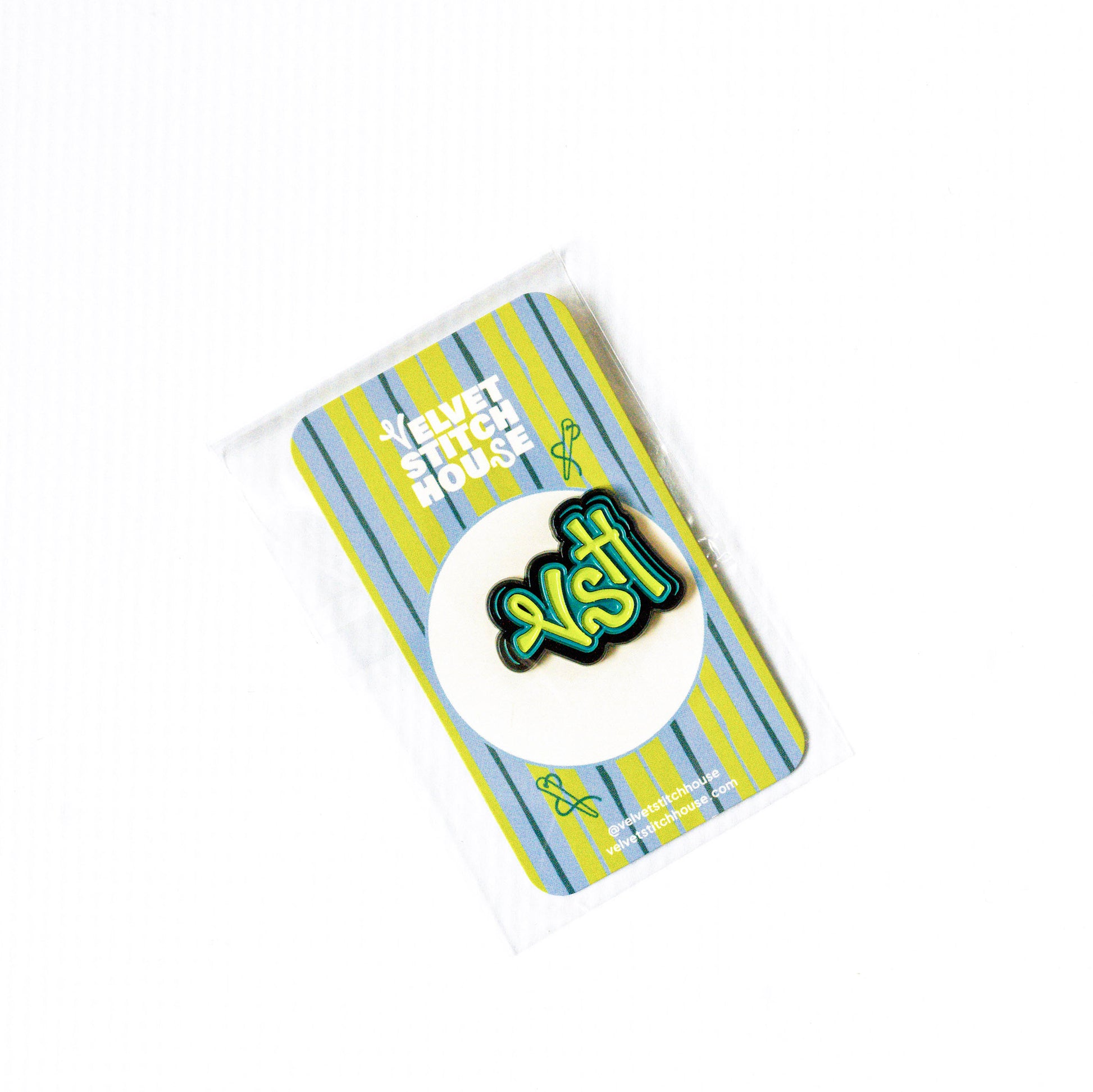 Magnetic Pin with 'VSH' design on a striped card
