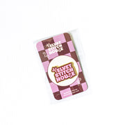 Pink and Red VElvet Stitch House Magnet with checkered pattern on a white background