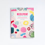 Book titled 'Needlepoint a Modern Stitch Directory" with colorful needlepoint patterns on a white background