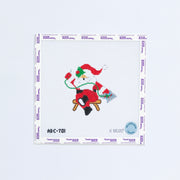 Needlepoint design of a santa with a red hat needlepointing with green thread. 
