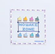 Needlepoint design of colorful sailboats with 'NOWAKE ZONE' text on a white background.