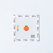 Needlepoint pattern with an orange on a white background