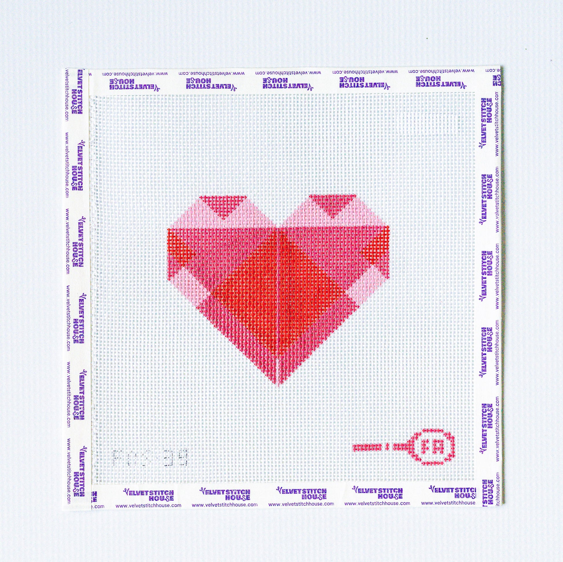 Needlepoint pattern with a geometric heart design on a white background