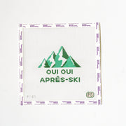Needlepoint design with green mountains and text on a white background