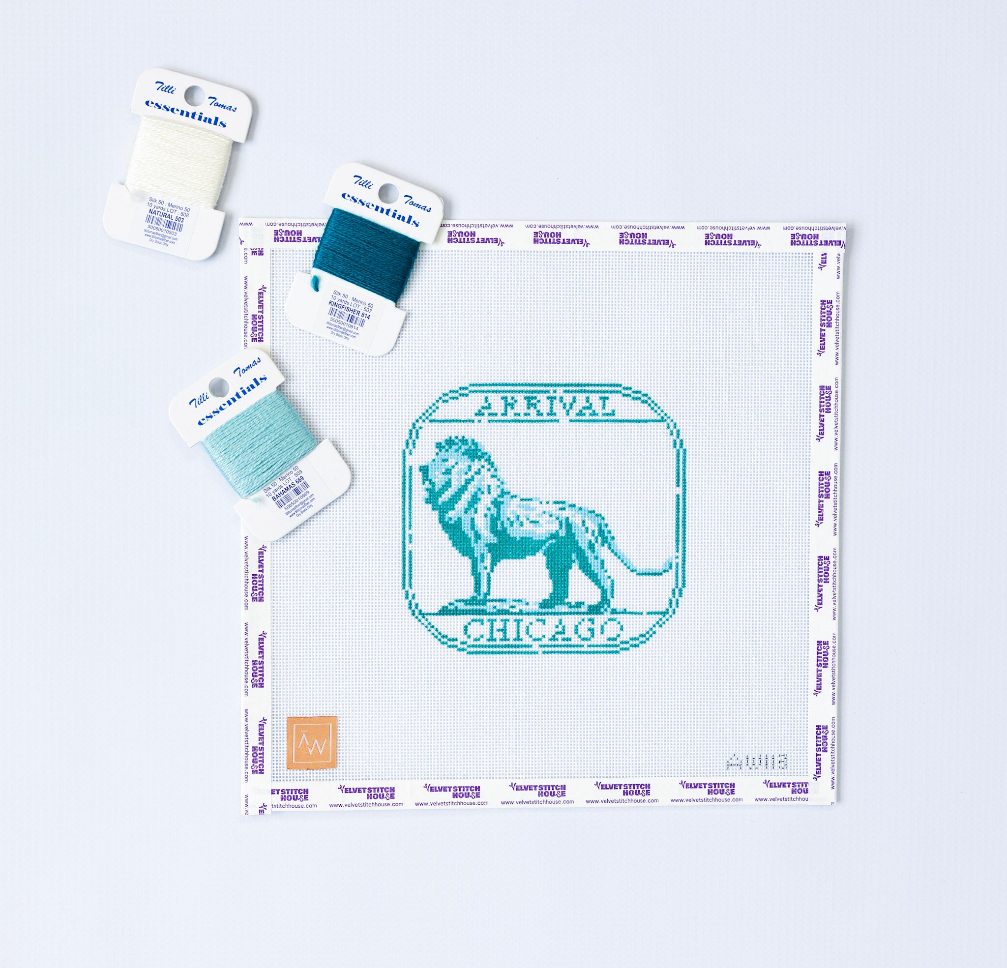 Needlepoint pattern of a green and teal stamp of Chicago with Arrival Chicago in text and a lion on a white background 