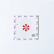 Needlepoint mini design with red and white round peppermint.