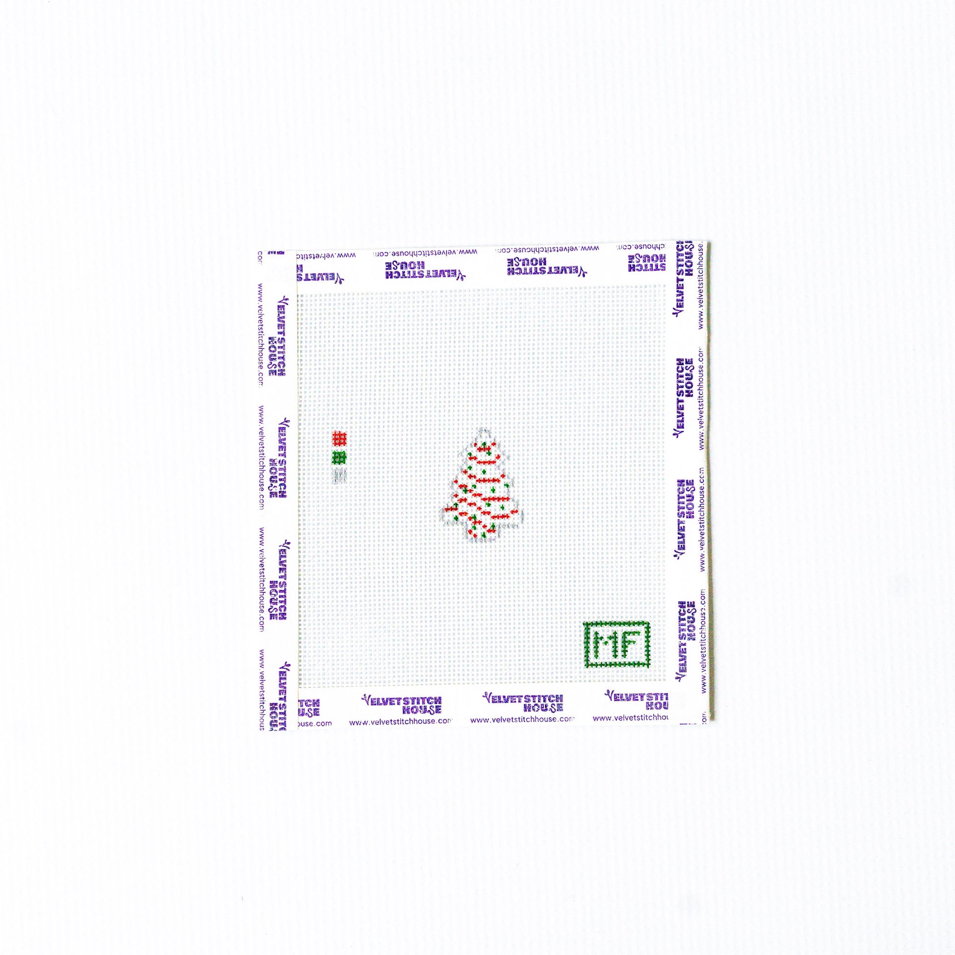 Mini white christmas tree needlepoint pattern with green and red lights. 