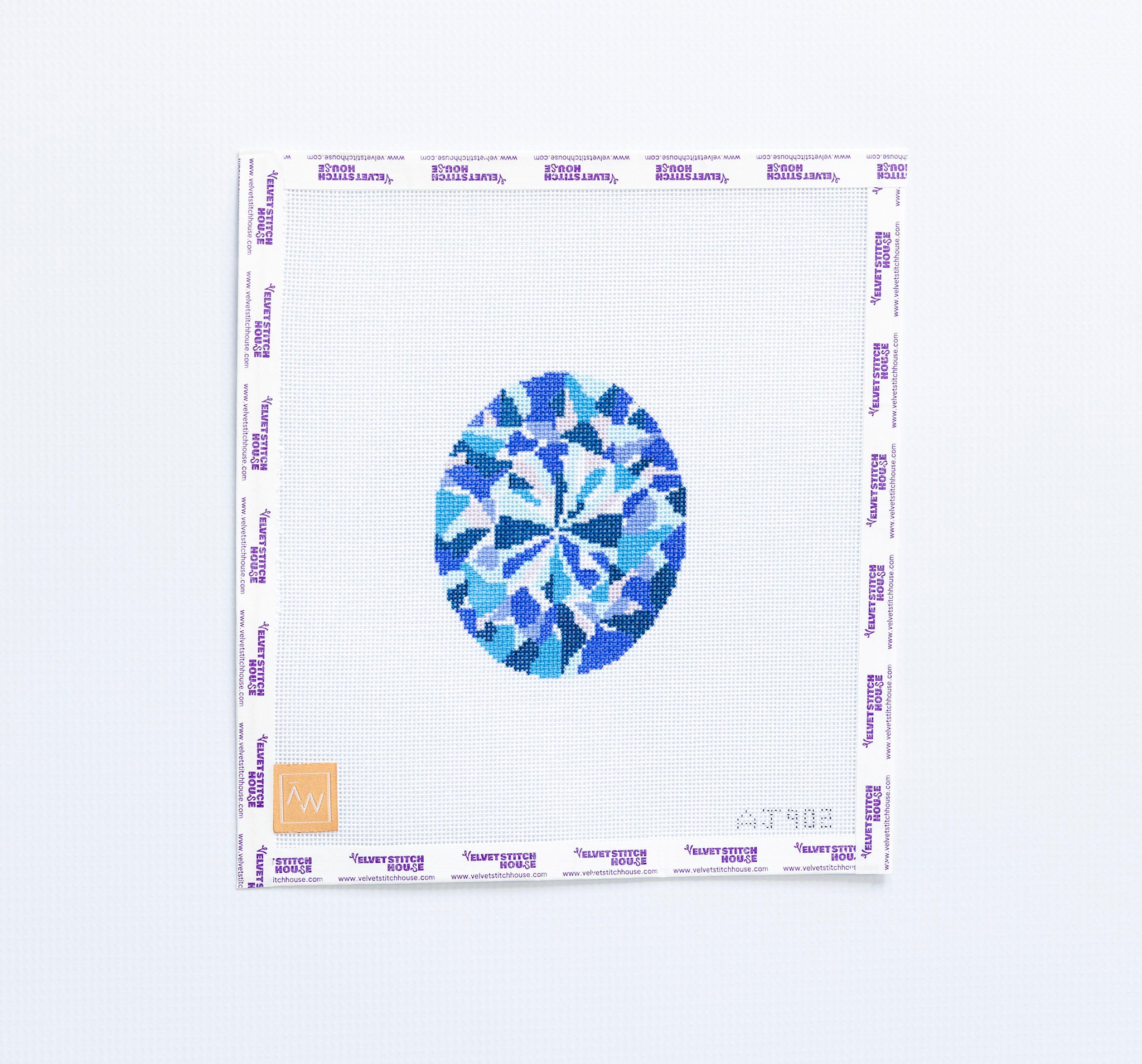 Needlepoint design of a Blue sapphire  on a white background 