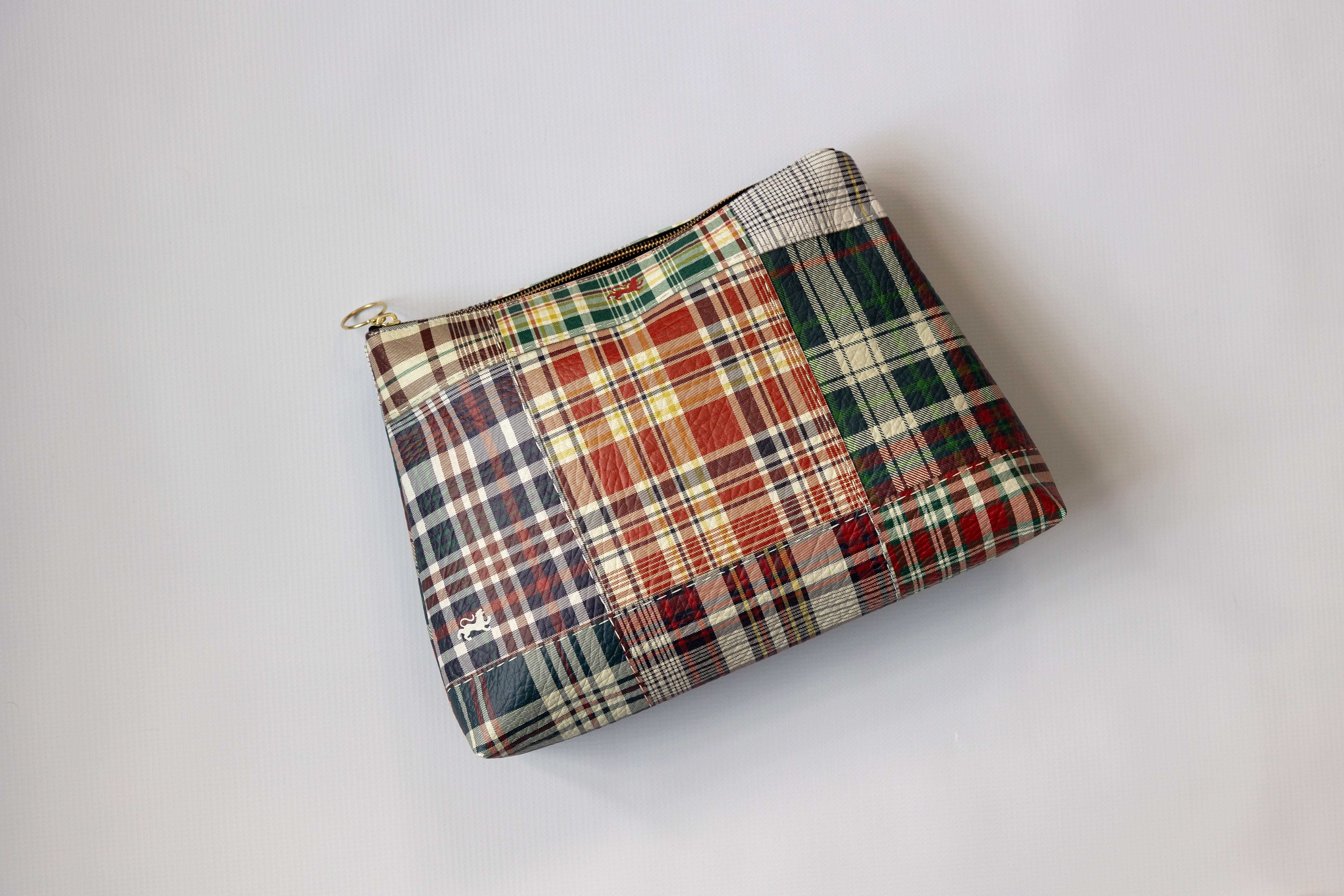 Plaid patterned pouch on a white background