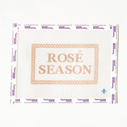 Needlepoint pattern with 'Rosé Season' text on a white background