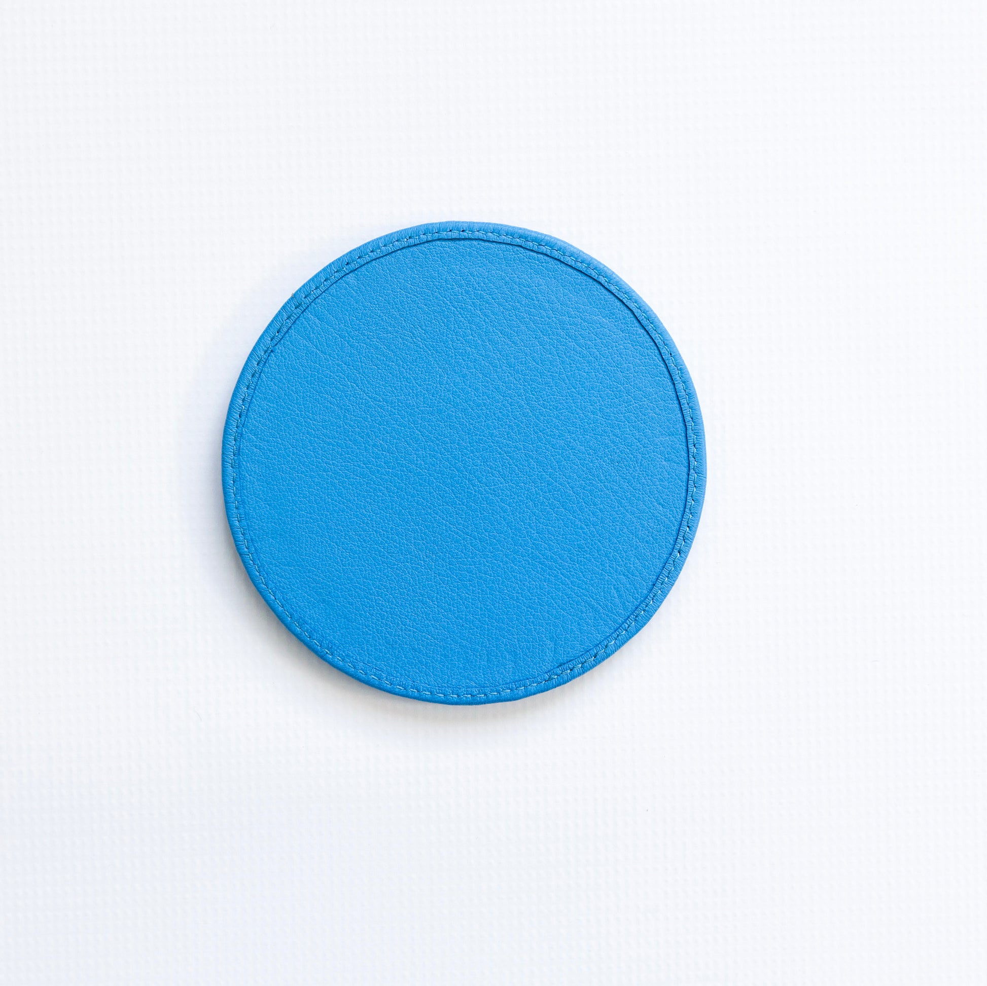 Blue circular patch on a white background
