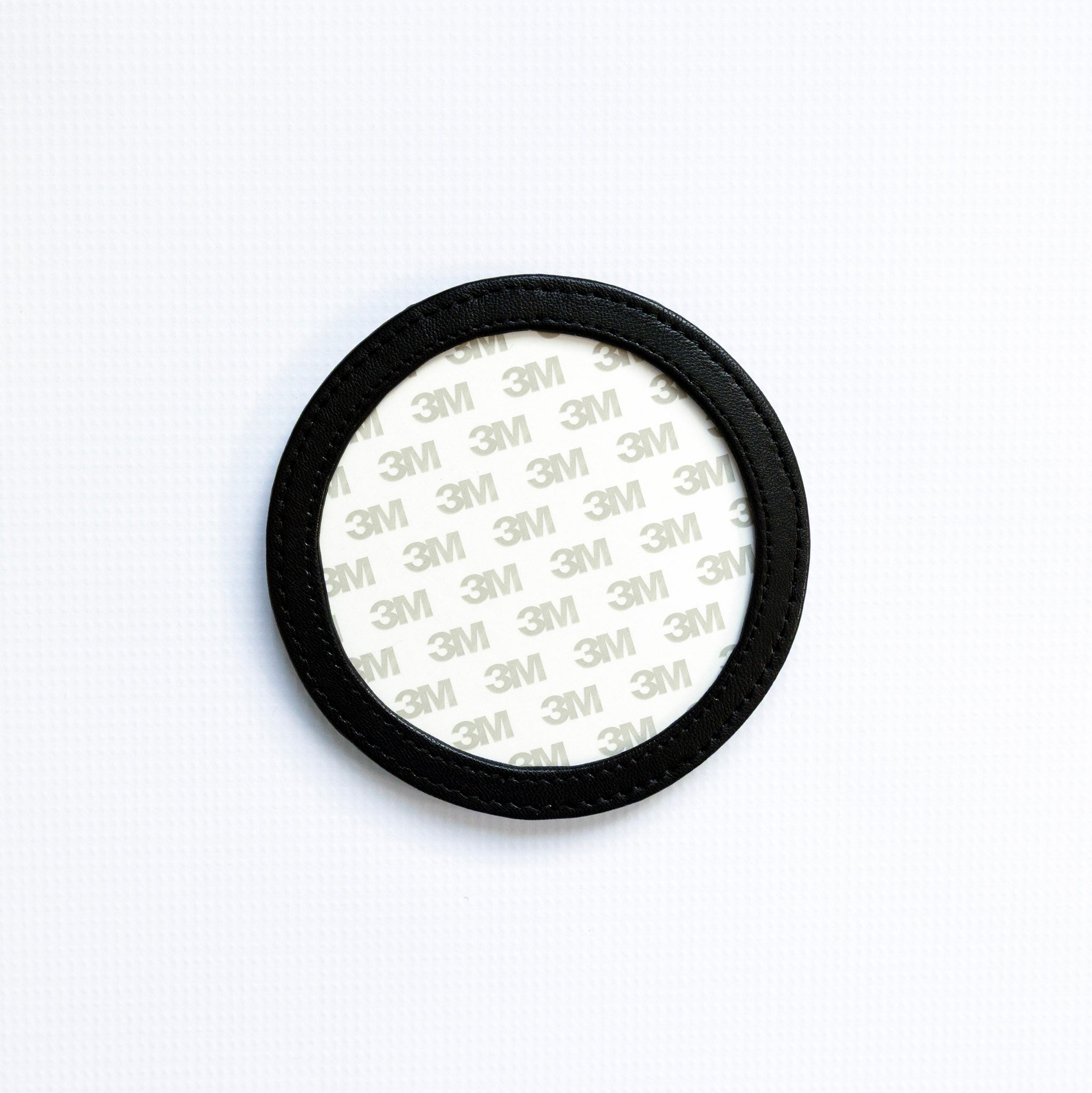 Round coaster with 3M adhesive on a white background
