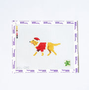Needlepoint pattern with a dog wearing a red coat and Santa hat on a white background.