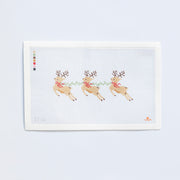 Needlepoint pattern of three reindeer with antlers on a white background