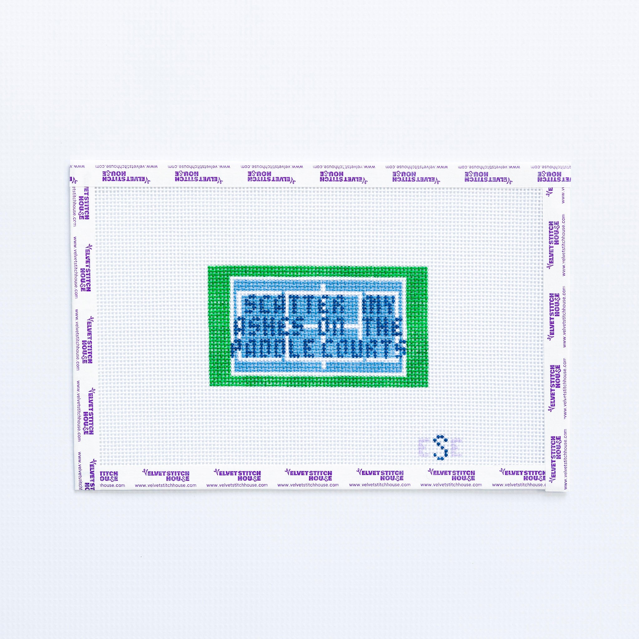 Needlepoint pattern with text 'Scattered my Ashes on the Paddle Courts' in green and blue on a white background