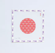 Needlepoint pattern with pink and red geometric circular design.