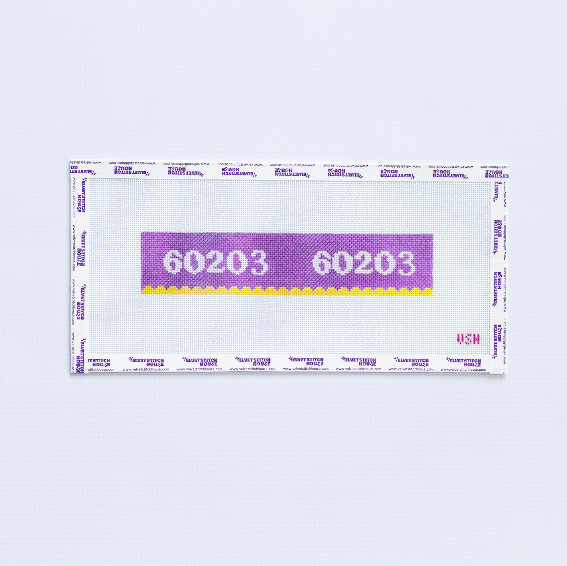 Needlepoint pattern key fob of a purple label displaying '60203' with yellow scallop edge.