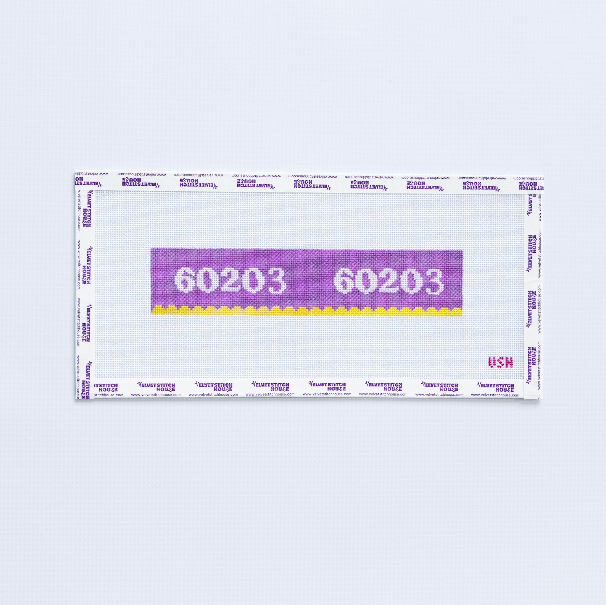 Needlepoint pattern key fob of a purple label displaying '60203' with yellow scallop edge.