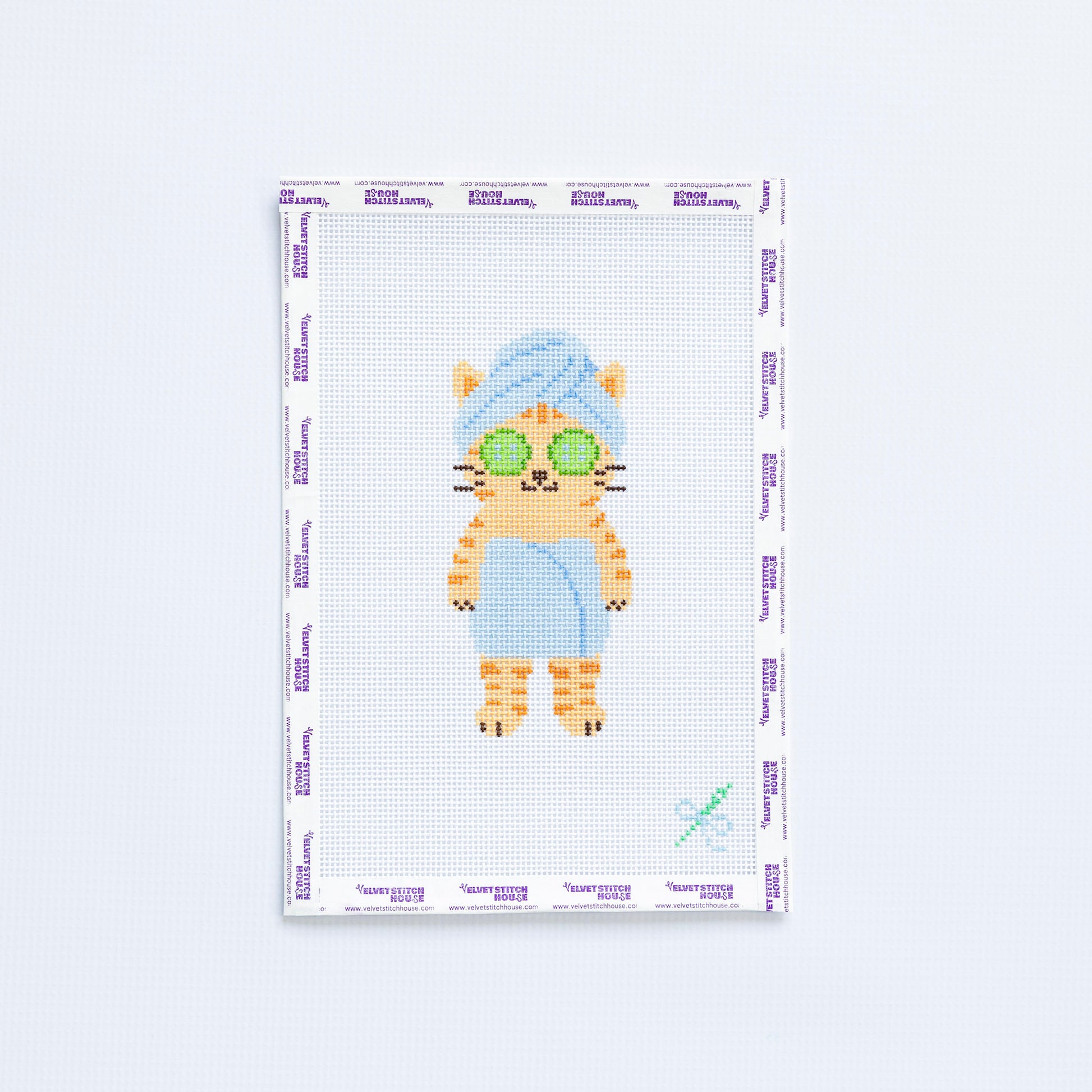 Needlepoint pattern of a cat with sunglasses and a towel on a white background