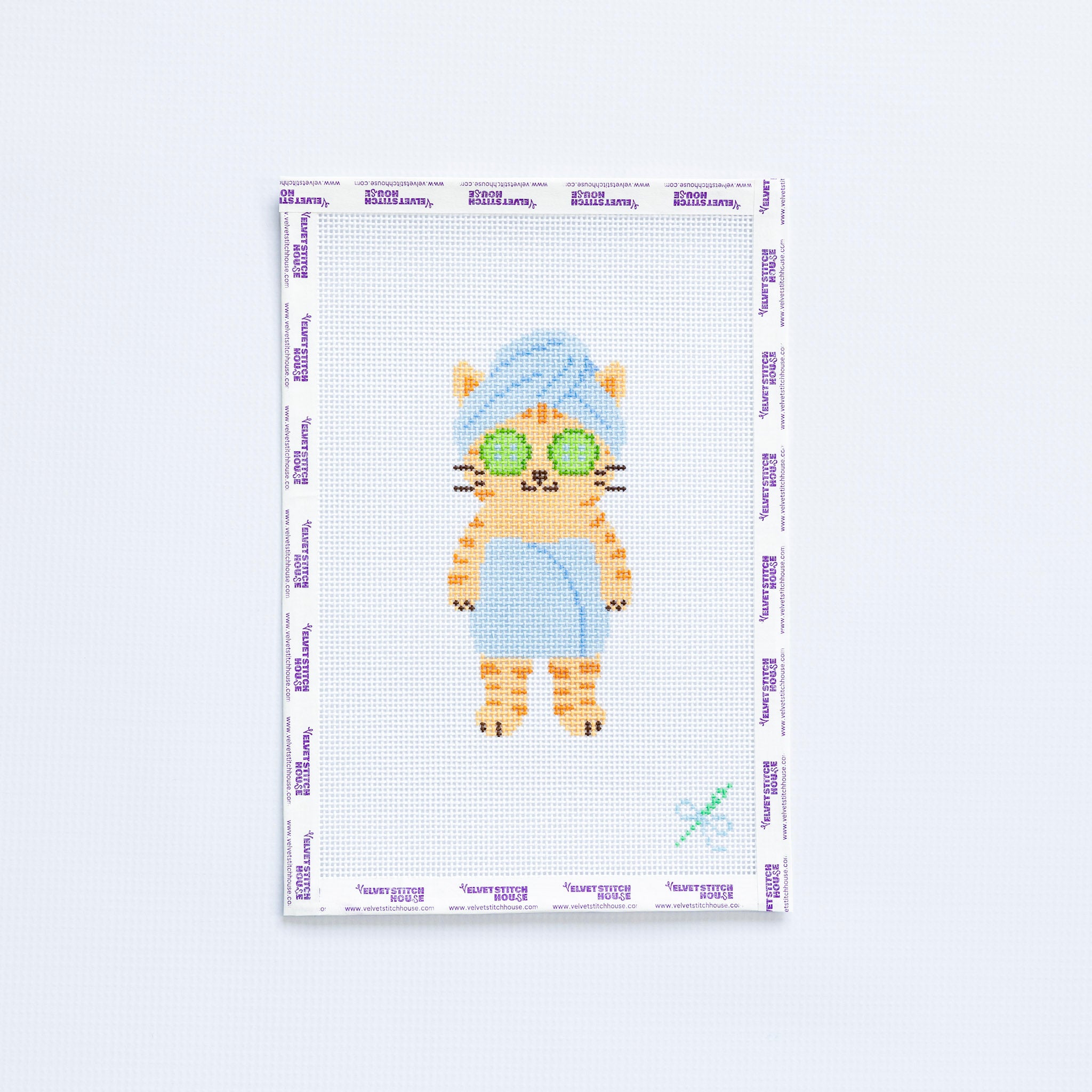 Needlepoint pattern of a cat with sunglasses and a towel on a white background