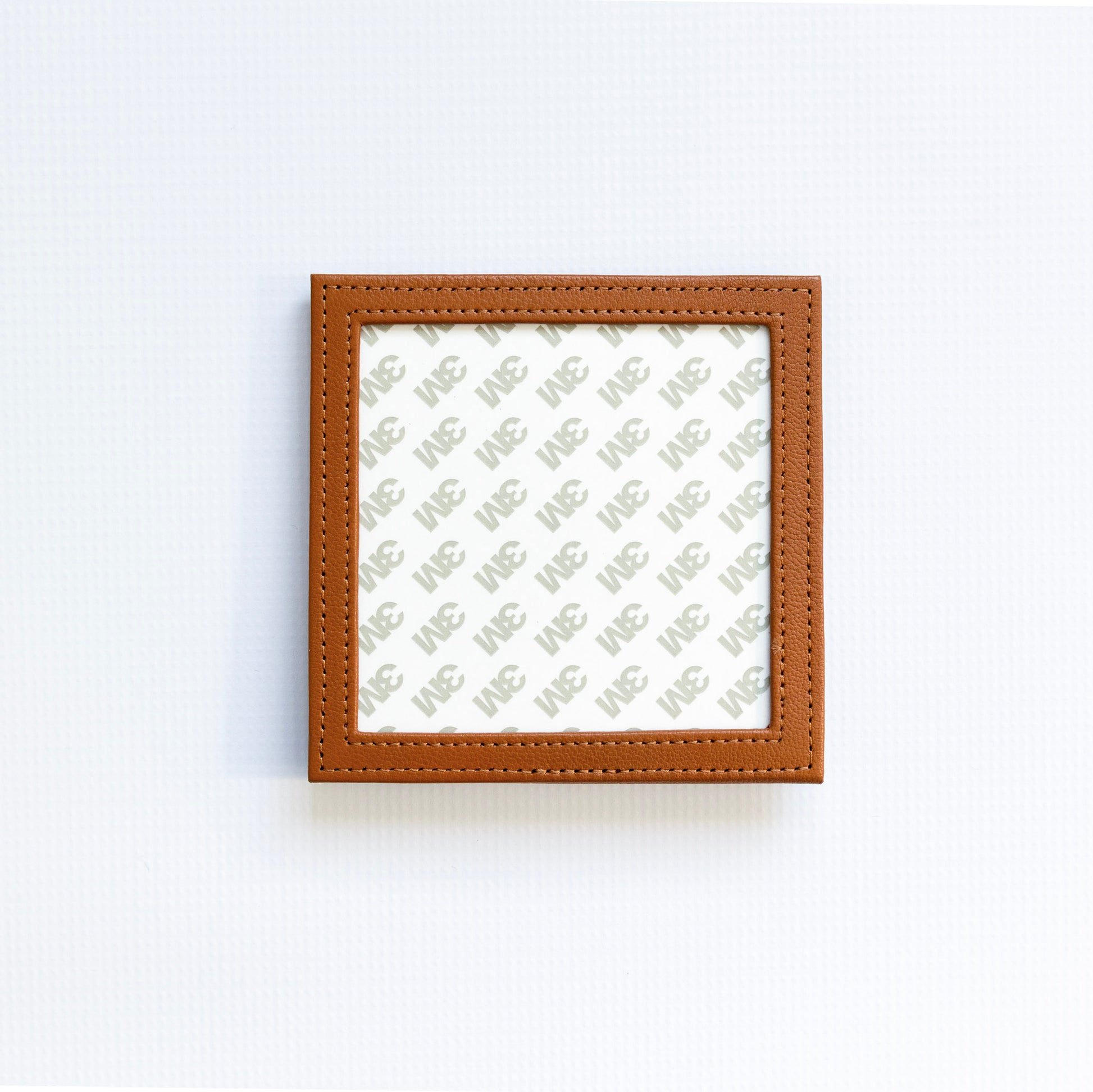 Small square self finishing frame with a brown border on a white background