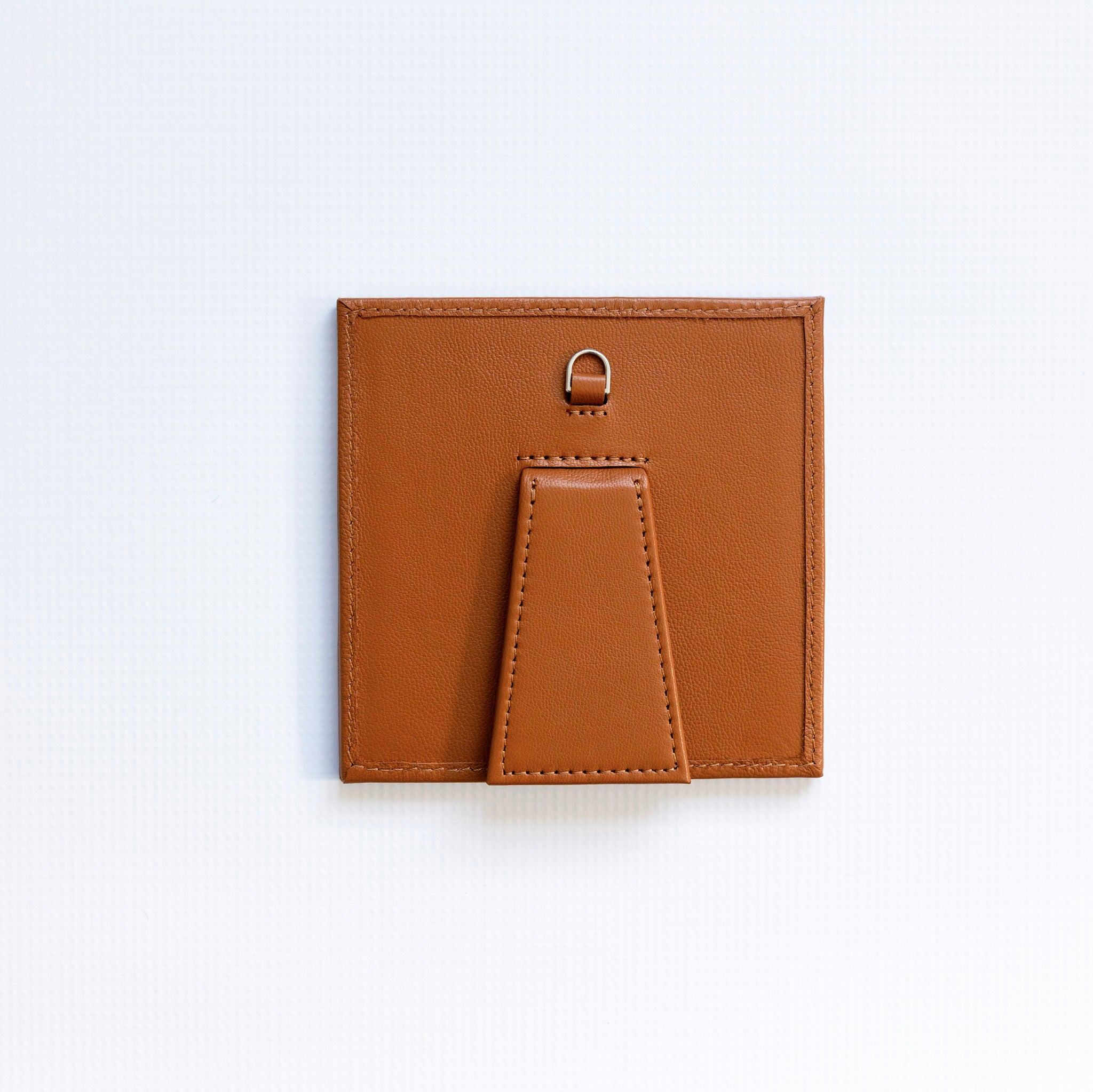 Small square self finishing frame with a brown border on a white background