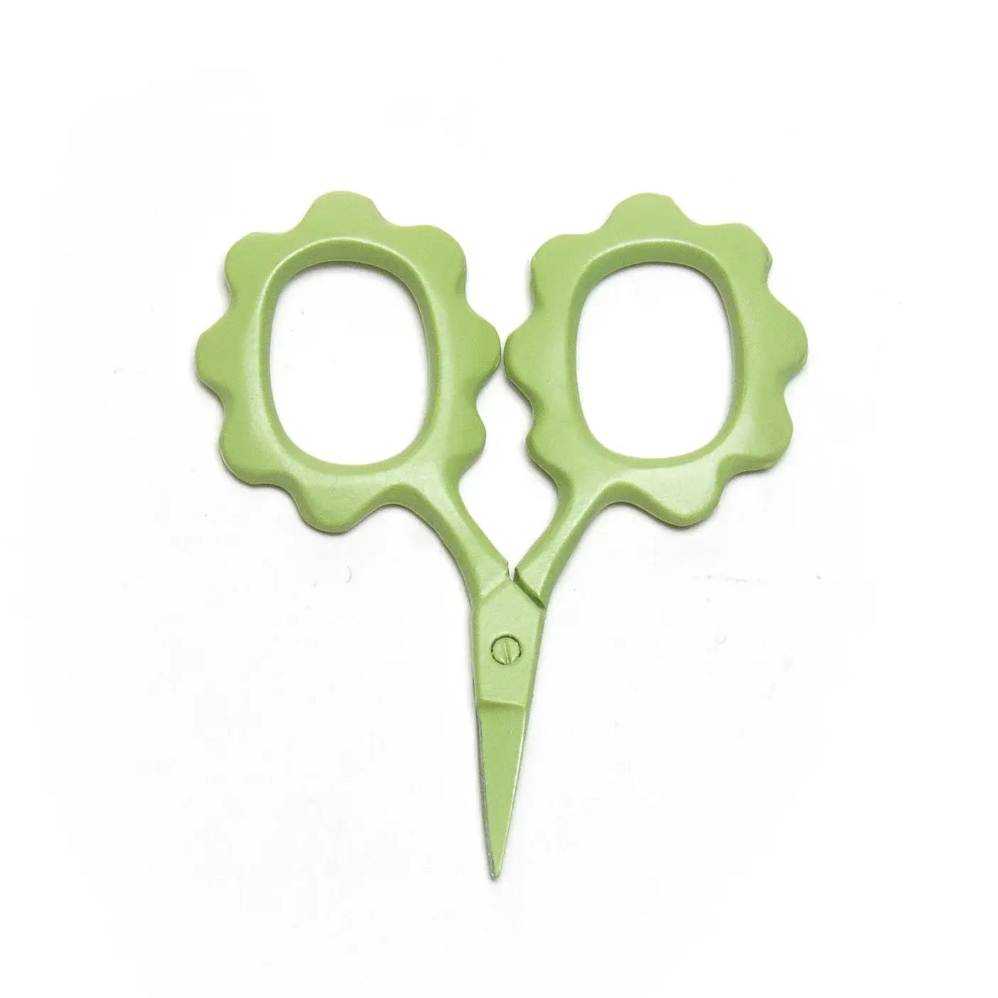 Mini Green scissors with floral handles on a white background