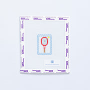 Needlepoint pattern of a red mini tennis racket with yellow tennis ball and light blue border