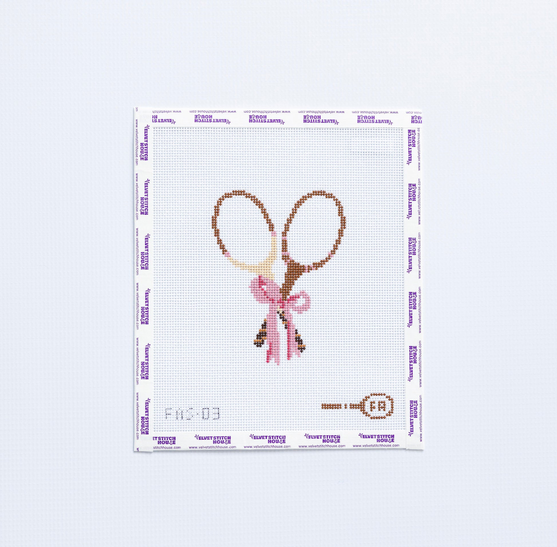 Needlepoint pattern with two vintage tennis rackets tied with a pink bow.