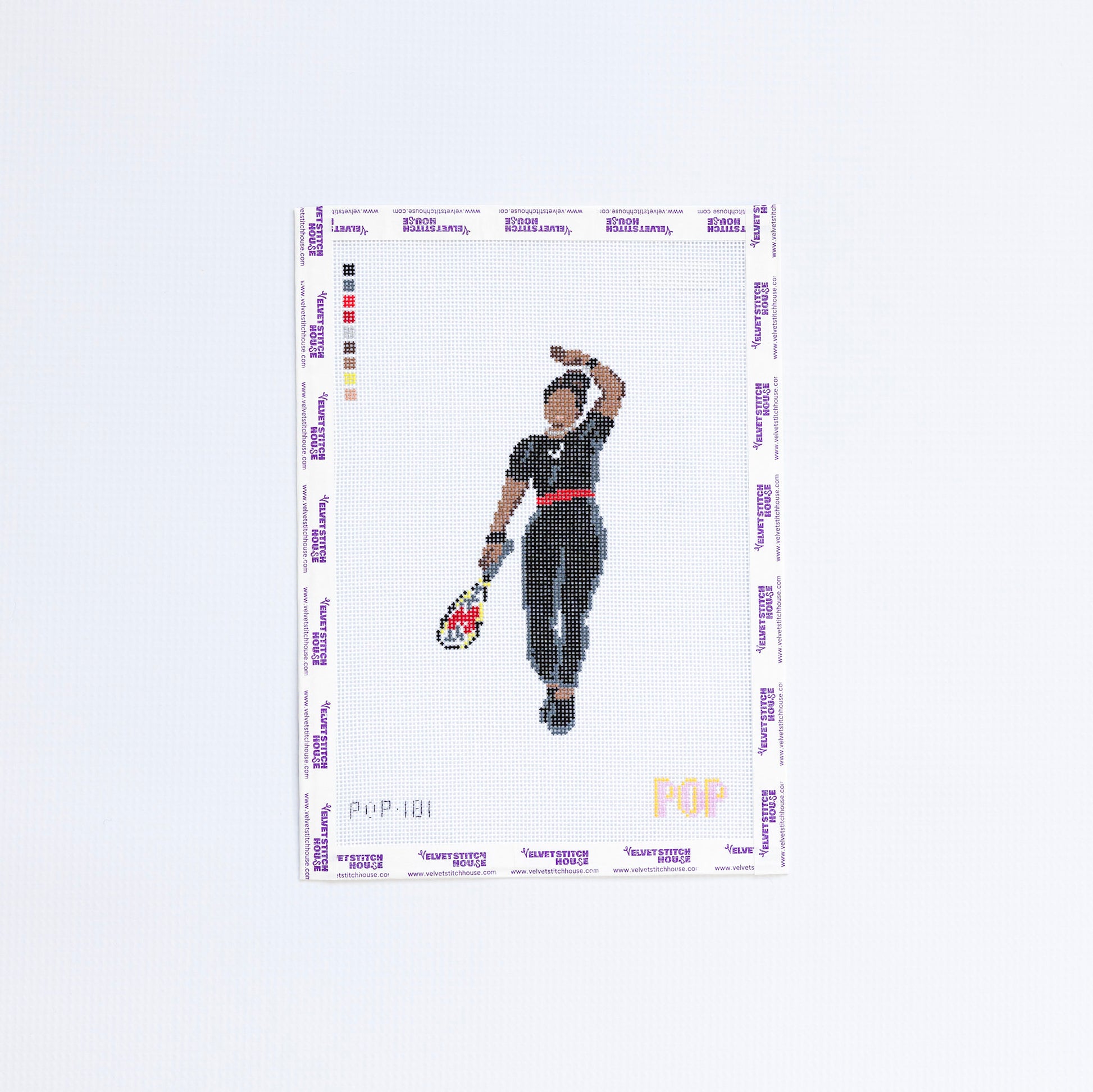 Needlepoint pattern of a tennis player holding a racket on a white background