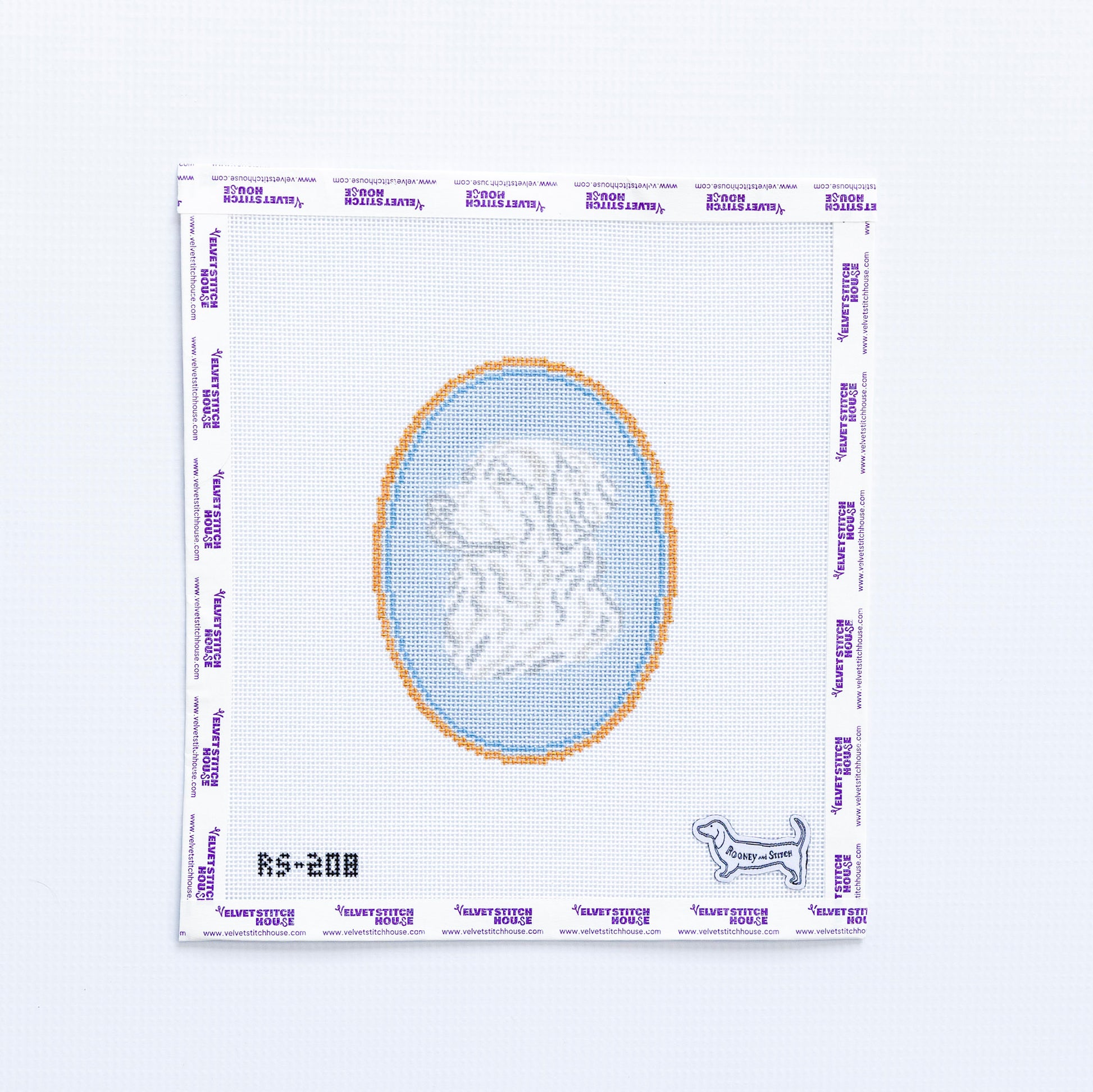 Needlepoint round pattern with a design of a golden retreiver on a light blue background