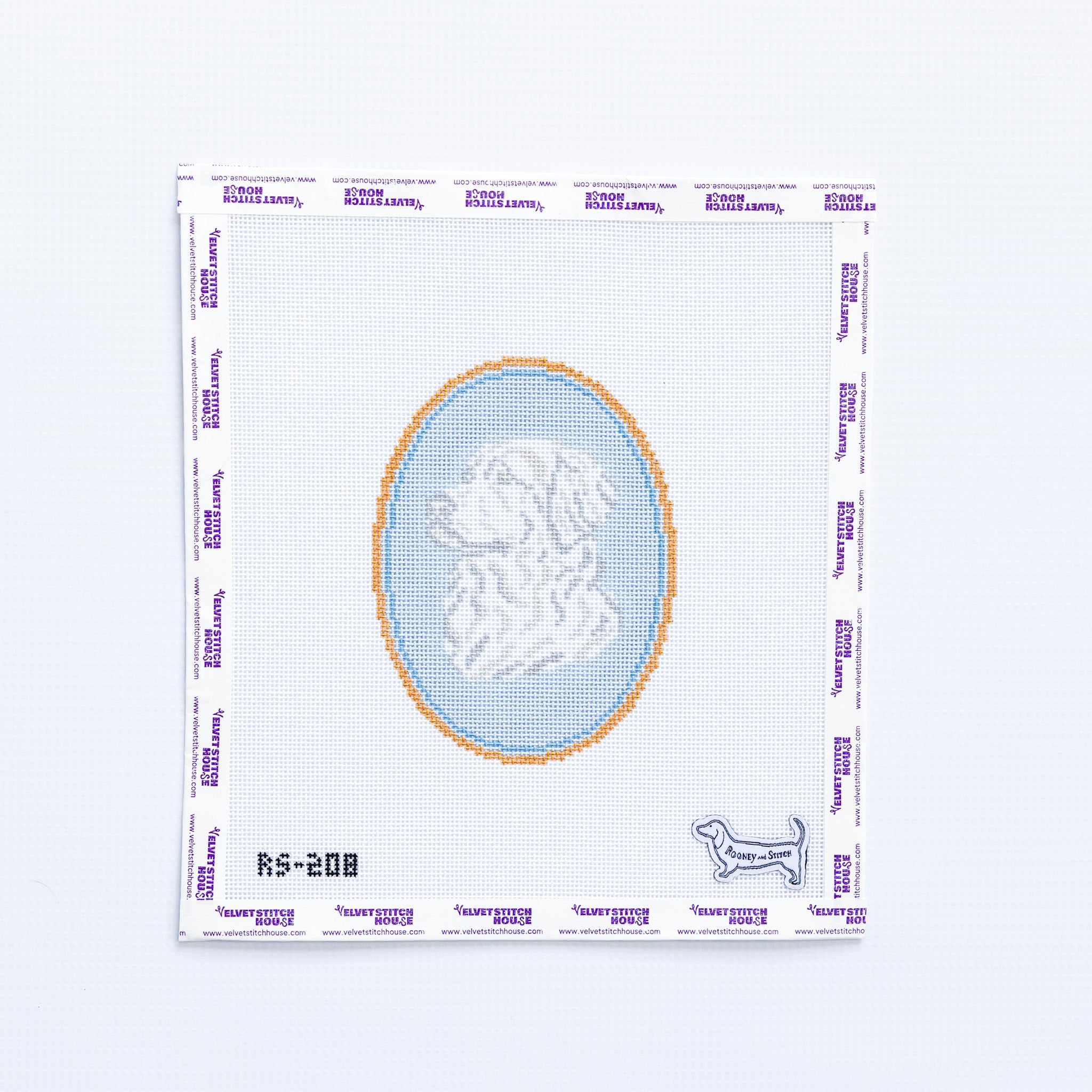Needlepoint round pattern with a design of a golden retreiver on a light blue background