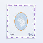 Needlepoint pattern with a short haired cat design on a light blue oval background.