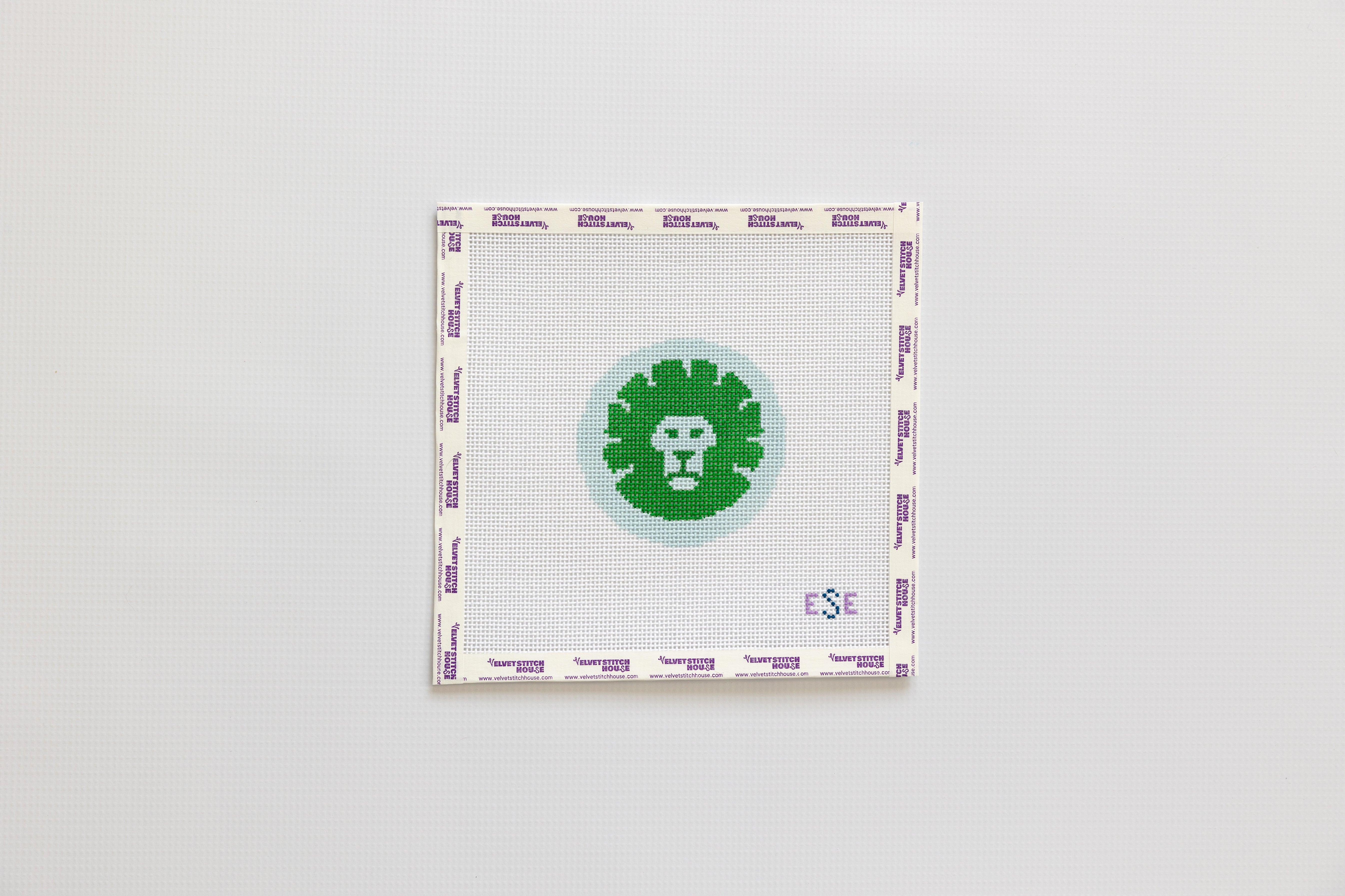 Square patch with a green circular design and Skokie School branding on white background