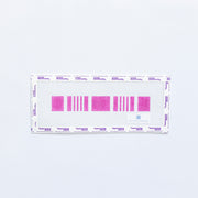Needlepoint key fob pattern in plum color on a white background